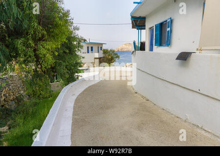 Street view of Potamos village with narrow alleys and traditional architecture in Antikythera island in Greece Stock Photo