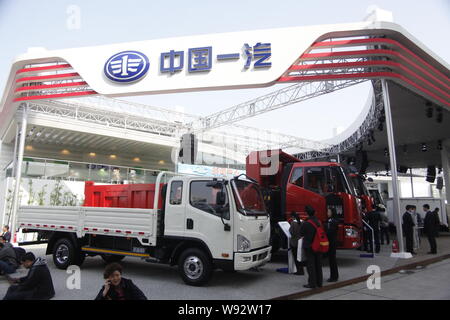 --FILE--People visit the stand of FAW (First Automobile Works)during the 15th Shanghai International Automobile Industry Exhibition, known as Auto Sha Stock Photo