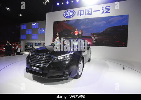 --FILE--People visit the stand of FAW during the 10th China (Guangzhou) International Automobile Exhibition, known as Auto Guangzhou 2012, in Guangzho Stock Photo