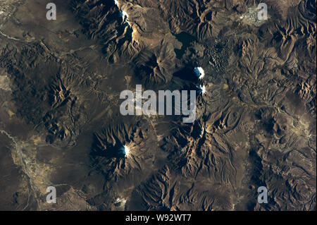 Chilean volcanos mountains relief Satellite view texture from earth above . Elements of this image furnished by NASA. Stock Photo