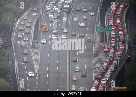 --FILE--Vehicles move slowly in a traffic jam in downtown Shanghai, China, 6 May 2013.    Shanghai is considering introducing a congestion charge on m Stock Photo