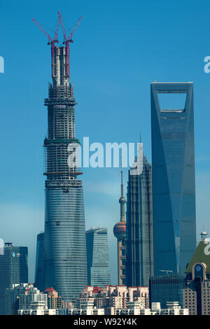 The Shanghai Tower, left, is under construction next to the