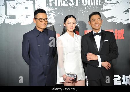 (From left) Hong Kong actor Michael Miu, Chinese actress Yao Chen, Hong Kong singer and actor Andy Lau pose during the opening ceremony for the 56th A Stock Photo