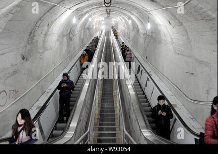 Tourists ride escalators through Mount Tianmen at Tianmen Mountain National Forest Park in Zhangjiajie city, central Chinas Hunan province, 28 Decembe Stock Photo