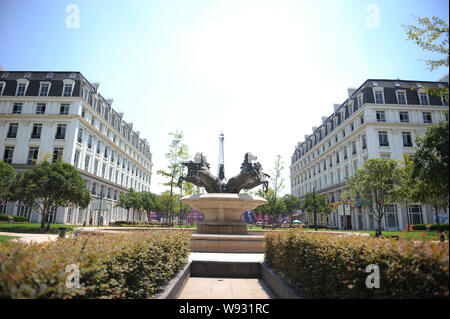 A fountain with horse sculptures is pictured in front of Parisian-style architecture at Tianducheng, a small Chinese community replicating Paris, in H Stock Photo