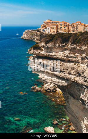 Old houses and city constructed on the edge of high cliffs in Bonifacio, in the mediterranean sea of Corsica Stock Photo