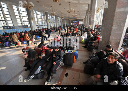 Passengers are seen at the waiting room of Beijing Railway Station during the first wave of Lunar New Year travel rush in Beijing, China, 26 January 2 Stock Photo