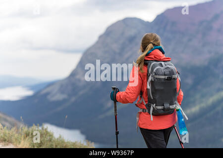 Female hiker is enjoying the view of the lakes in Montana