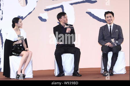 Chinese actress Zhang Ziyi (left), Taiwanese actor Zhang Zhen (center), and Hong Kong actor Tony Leung talk about their latest movie, The Grandmaster, Stock Photo