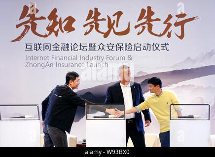 Jack Ma Yun, right, Chairman of Alibaba Group, shakes hands with Pony Ma Huateng, left, Chairman and CEO of Tencent, next to Ma Mingzhe, Chairman of P Stock Photo