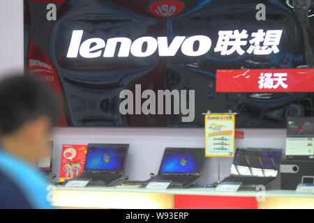 --FILE--Lenovo laptop computers are for sale at a home appliances store in Nantong city, east Chinas Jiangsu province, 5 December 2012.   Intelligence Stock Photo
