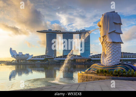 singapore, singapore - June 9, 2019: sunrise at the marina in singapore with the iconic building, merlion