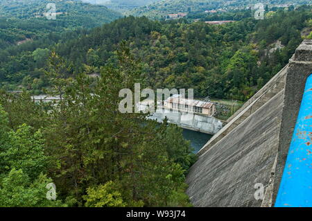 a small old dam on the lake, made of wooden parts, a closeup of a ...