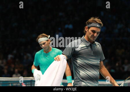 Roger Federer of Switzerland, front, and Rafael Nadal of Spain are pictured during their mens singles semifinal match of 2013 ATP World Tour Finals in Stock Photo