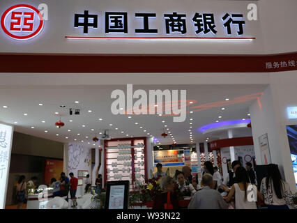 --FILE--People visit the stand of Industrial and Commercial Bank of China (ICBC) during an expo in Guangzhou, southeast Chinas Guangdong province, 23 Stock Photo