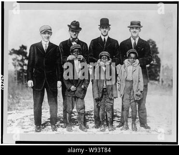 Abe Rachlin (prospect from Newark), Ad Brennan, Jim Moroney, Frank Scanlan, & three Afro-American boys who were mascots (baseball) Stock Photo