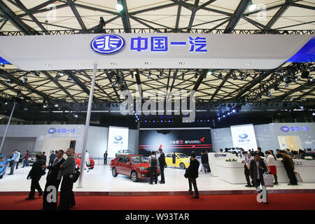 --FILE--People visit the stand of FAW (First Automobile Works)during the 15th Shanghai International Automobile Industry Exhibition, known as Auto Sha Stock Photo