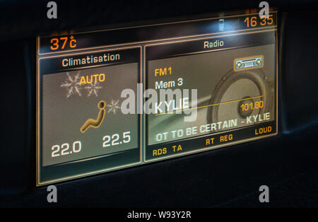Kylie playing display in built in car entertainment in French car Stock Photo