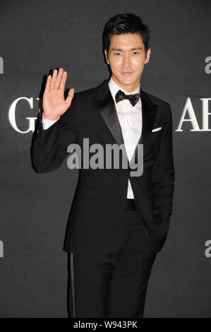 South Korean actor and singer Choi Si Won waves as he arrives for