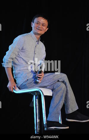 --FILE--Jack Ma Yun, right, Chairman of Alibaba Group, smiles at a dialogue during the Annual Summit of Green Companies 2013 in Kunming city, southwes Stock Photo