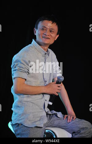 --FILE--Jack Ma Yun, right, Chairman of Alibaba Group, smiles at a dialogue during the Annual Summit of Green Companies 2013 in Kunming city, southwes Stock Photo