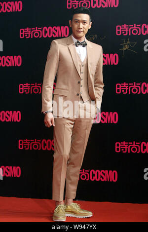 Chinese actor Lu Yi poses on the red carpet as he arrives at the 2013 Cosmo Grand Ceremony in Shanghai, China, 7 November 2013. Stock Photo