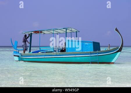 Ari Atoll, Maldives - 25 December 2018: A maldivian sailor is fishing on his boat Stock Photo