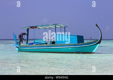 Ari Atoll, Maldives - 25 December 2018: A maldivian sailor is fishing on his boat Stock Photo