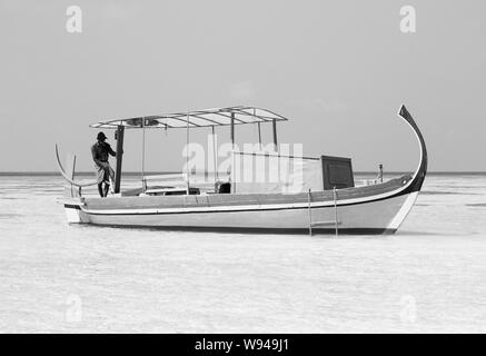 Ari Atoll, Maldives - 25 December 2018: A maldivian sailor is fishing on his boat Stock Photo