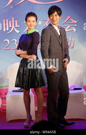 Taiwanese actor Vic Chou, right, poses with Chinese actress Liu Shishi during a press conference for their new movie, A Moment of Love, in Beijing, Ch Stock Photo