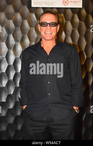 Hollywood action star Jean-Claude Van Damme poses during a press conference for his upcoming new film in Hong Kong, China, 19 June 2013. Stock Photo