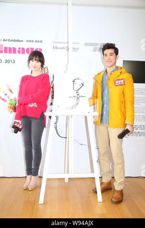 South Korean actress Ku Hye Sun, left, and Hong Kong actor Aarif Lee pose with the portrait that Ku drew for Lee at the opening event for Kus solo art Stock Photo