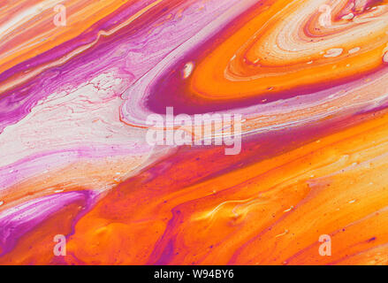 photography of abstract marbleized effect background. red, pink, orange and white creative colors. Beautiful paint Stock Photo