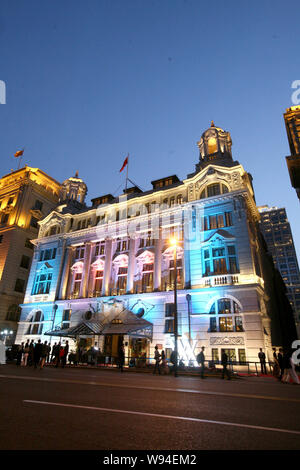 --FILE--Night view of the Waldorf Astoria Shanghai on The Bund hotel in Shanghai, China, 18 April 2011.   Hilton has opened 35 hotels in China under f Stock Photo