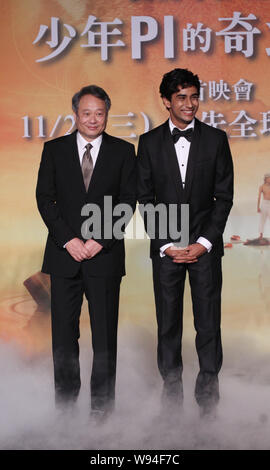 Taiwanese director Ang Lee, left, Indian actor Suraj Sharma, pose during a press conference for the 3D movie, Life of Pi, in Taipei, Taiwan, 7 Novembe Stock Photo