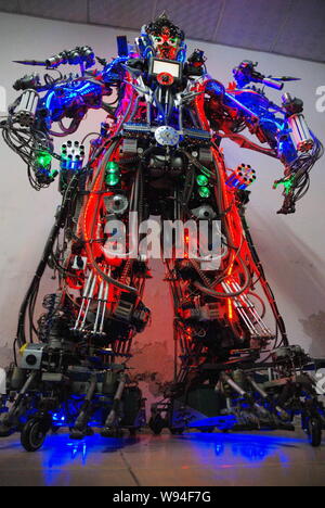 The robot made from scrap by Chinese farmer Tao Xiangli is displayed at his home in Beijing, China, 16 May 2013.   Tao Xiangli, a 37-year-old inventor Stock Photo