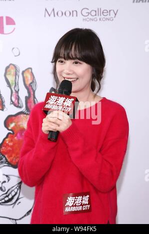 South Korean actress Ku Hye Sun speaks at the opening event for her solo art exhibition, After Image, in Hong Kong, China, 14 October 2013. Stock Photo