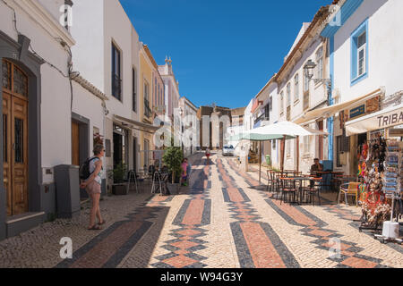 Pedestrian street with decorative tiles in the Algarve town of Lagos in Portugal Stock Photo