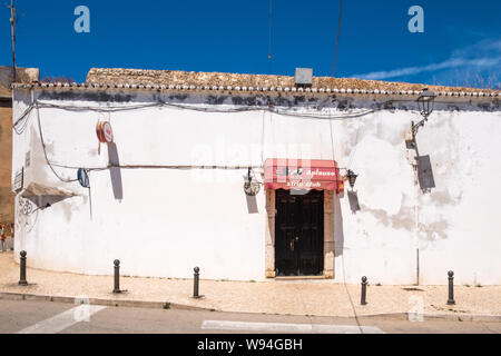 Run down building with entrance marked 'strip club' in the Algarve town of Lagos in Portugal Stock Photo