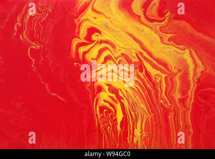 photography of abstract marbleized effect background. red and yellow creative colors. Stock Photo