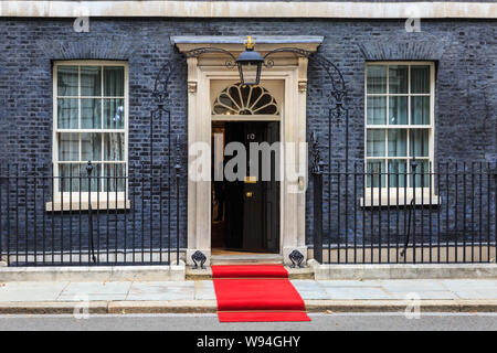 A red carpet is installed outside No 10 Downing Street for a Head of State visit, London, UK Stock Photo