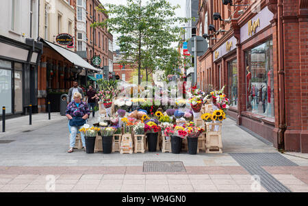 Flower seller on Grafton Street, Dublin city, Ireland. Stock Photo