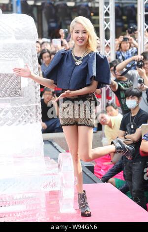 Taiwanese singer Jolin Tsai poses during a signing event for her concert DVD in Taipei, Taiwan, 27 October 2013. Stock Photo