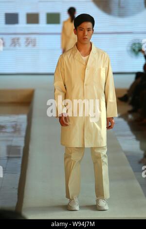 A Chinese nurse displays a new hospital uniform during a fashion show in Beijing, China, 1 April 2013.   A special fashion show was held at a hospital Stock Photo