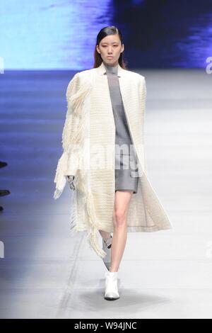 A model displays a new creation by Italian fashion designer Gabriele Colangelo in the Gabriele Colangelo fashion show during the Mercedes-Benz China 2 Stock Photo