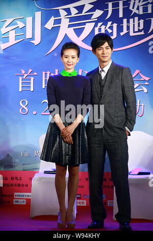 Taiwanese actor Vic Chou, right, poses with Chinese actress Liu Shishi during a press conference for their new movie, A Moment of Love, in Beijing, Ch Stock Photo