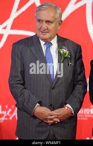 Former French Prime Minister Jean-Pierre Raffarin poses during the opening ceremony for the flagship store of Galeries Lafayette in Beijing, China, 18 Stock Photo