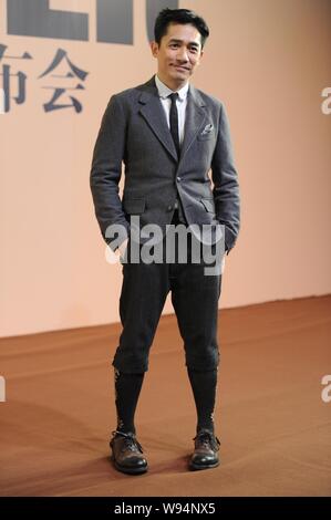 Hong Kong actor Tony Leung poses as he arrives for the premiere of his latest movie, The Grandmaster, in Beijing, China, 6 January 2013.    Hong Kong Stock Photo