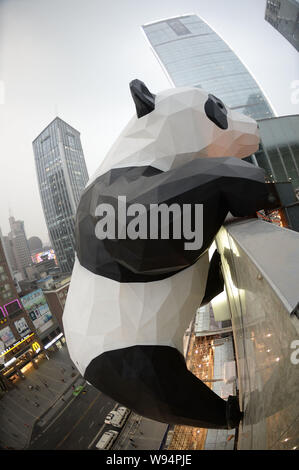 A giant panda-shaped art installation is being installed on the facade of the Chengdu IFS shopping mall in Chengdu city, southwest Chinas Sichuan prov Stock Photo