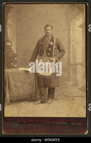 African American man, member of the Grand United Order of Odd Fellows, wearing fraternal order collar and apron / A.C. Golsh, 411 Main St., opp. Pico House, Los Angeles, Cal Stock Photo